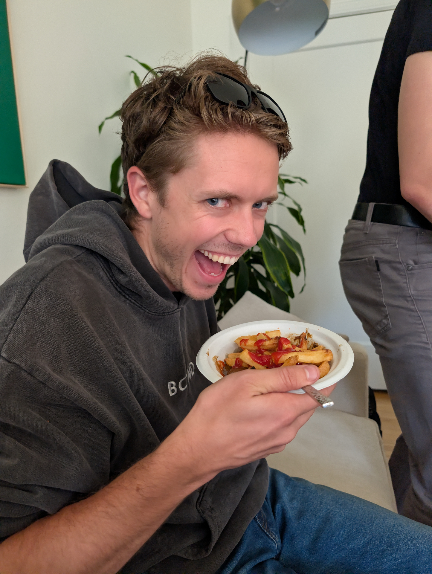 A friend enjoying food at home