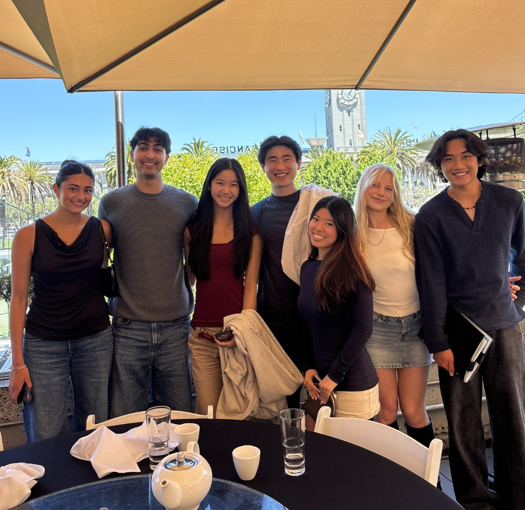 Group of friends at a sunny outdoor lunch by the Ferry Building
