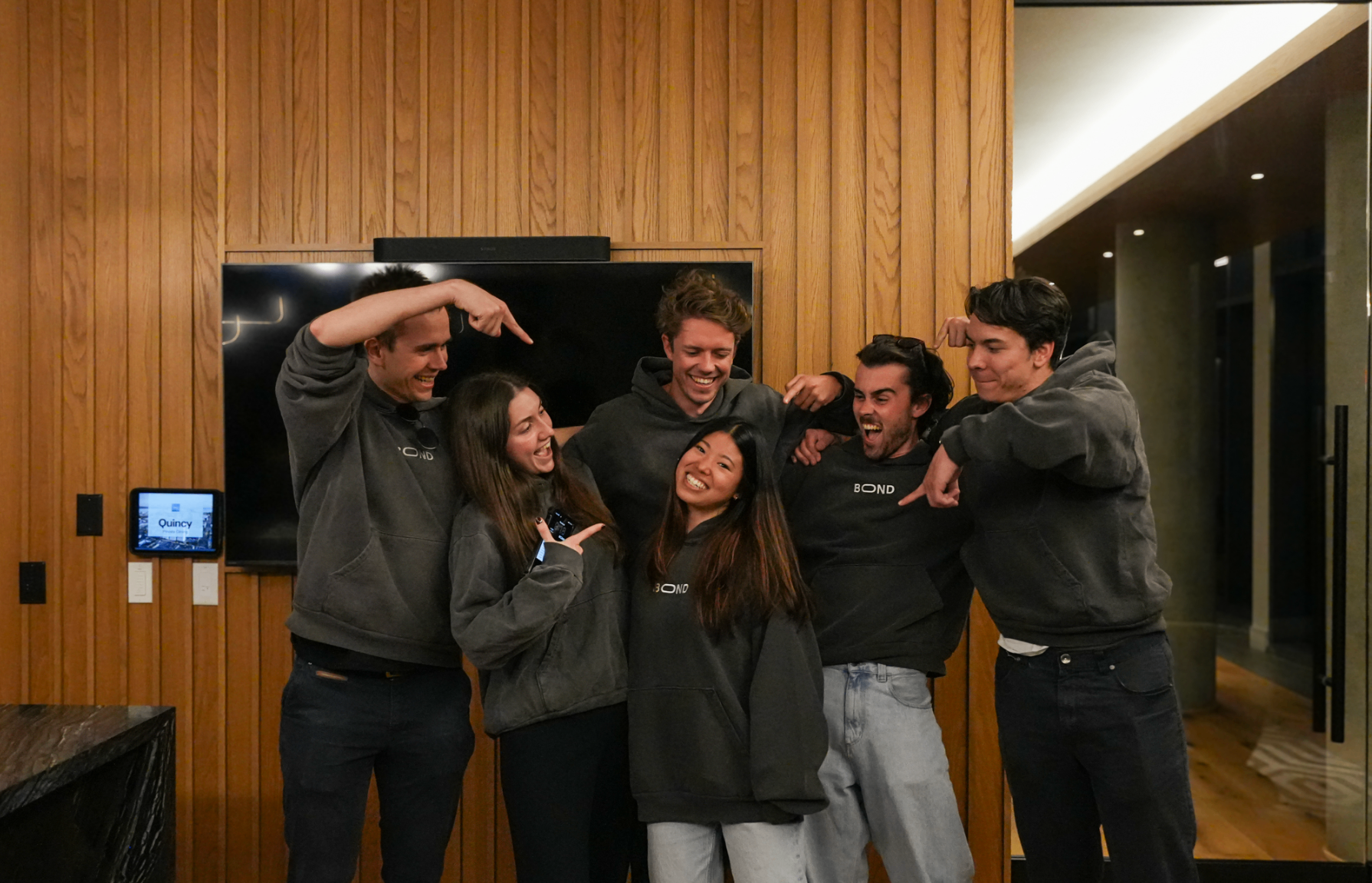 The Bond team in matching hoodies